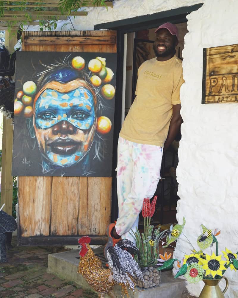 Tinashe Kachama at his studio at Old Nick Village, Plettenberg Bay, working on a beaded sculpture