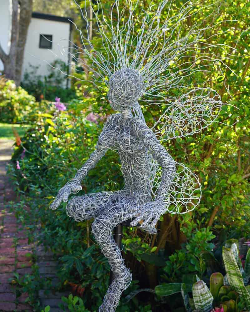 Paivepo wire sculpture — an intricate wire fairy with beaded accents, displayed at the studio